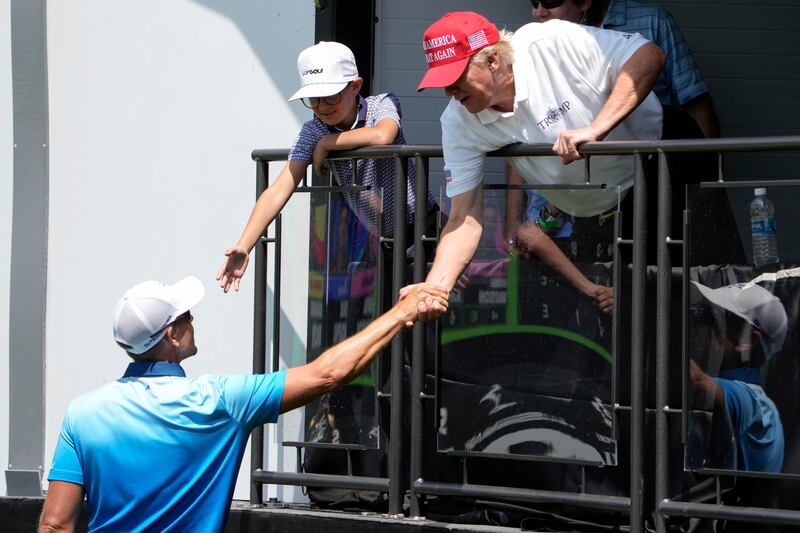 Henrik Stenson shakes hands with Mr Trump during the second round of the LIV Golf at Trump National Golf Club in Sterling. AP