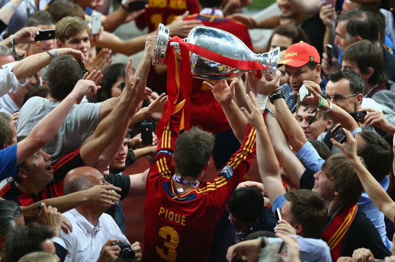 Gerard Pique of Spain celebrates with the trophy after the Euro 2012 final victory against Italy at the Olympic Stadium on July 1, 2012 in Kiev, Ukraine. Getty Images