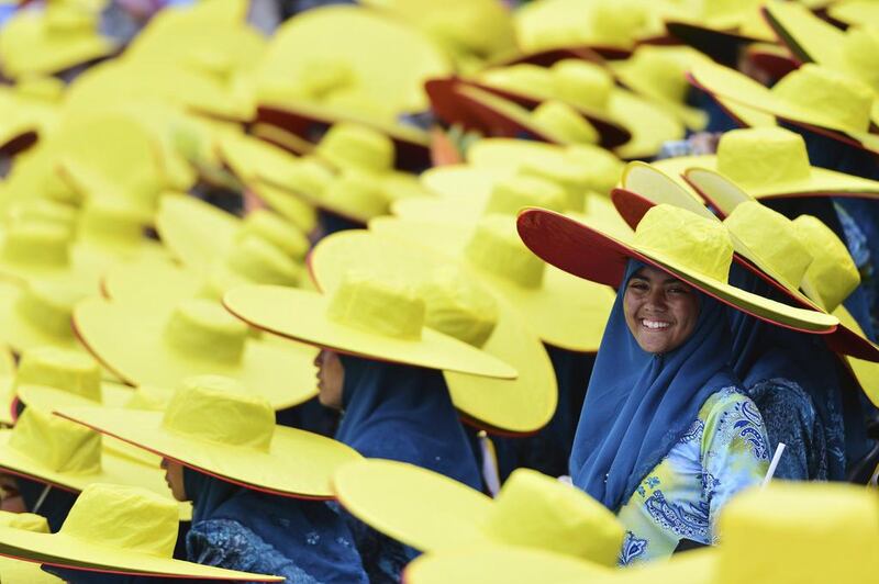 A performer smiles during celebrations for Brunei’s 30th National Day, in Bandar Seri Begawan on February 23, 2014. Ahim Rani / Reuters
