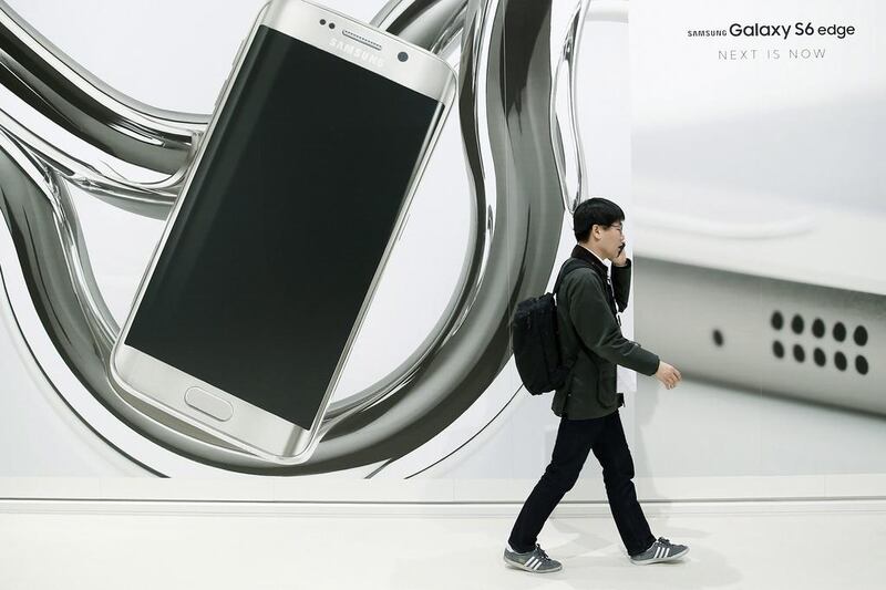 A visitor walks in front of advertising of the new Samsung Galaxy S6 edge. The MWC 2015 is running from March 2 to 5 and is said to be the world's largest mobile technology event.  EPA