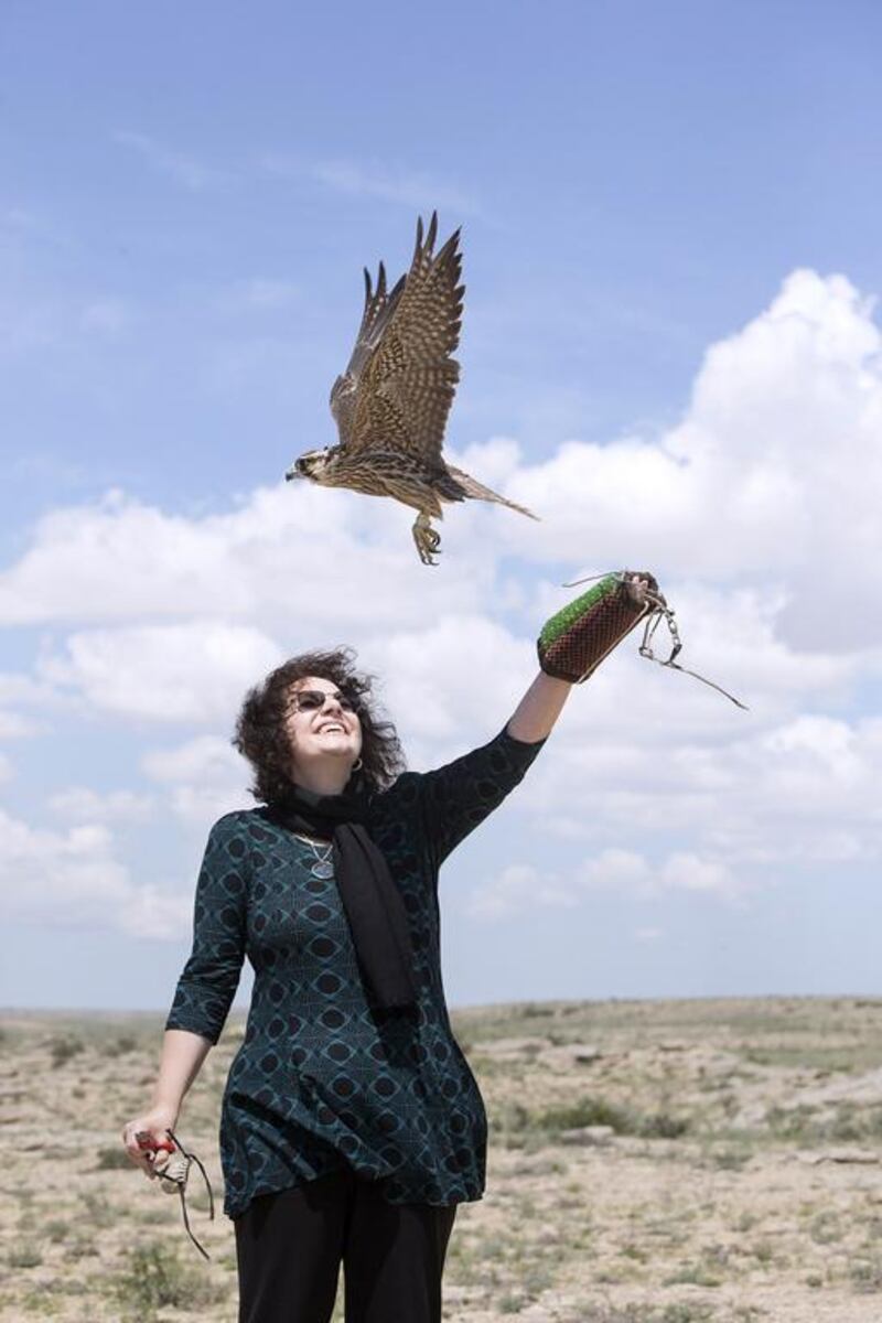 Director and head Veterinarian of the Abu Dhabi Falcon Hospital Dr. Margit Muller, releases a peregrin falcon, as she, along with other members of the Sheikh Zayed Falcon Release Programme release 55 falcons back into the wild in Aktau, Kazakhstan. Silvia Razgova / The National