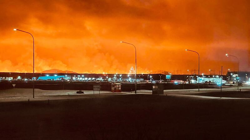 Smoke billows near the town of Keflavik, with the eruption turning the sky orange. AFP