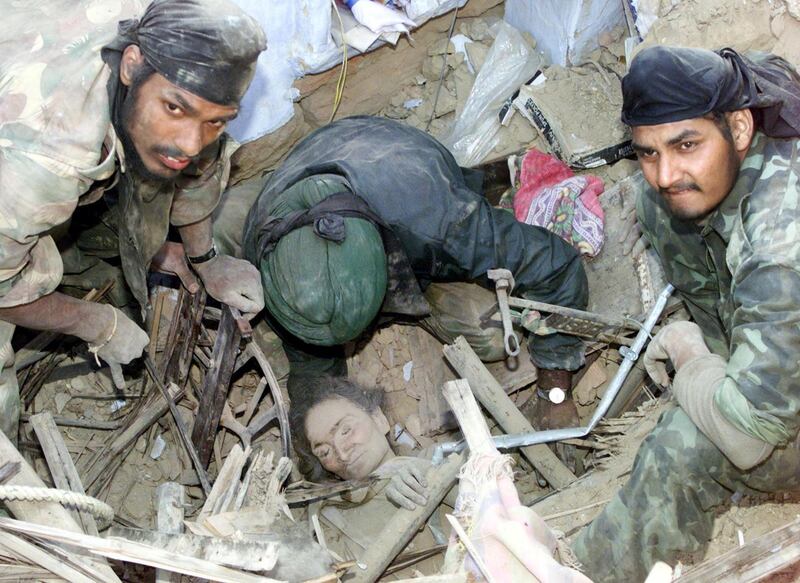 POY - YEAREND PICTURES 2001 - Indian soldiers discover a survivor amid
the rubble of a collapsed building after she had been trapped inside
from more than 72 hours in the western Indian city of Bhuj on January
29, 2001. The devastating earthquake, which hit the rich industrial and
agricultural state, killed an estimated 20,000 people and injured tens
of thousands more. Around 400 experts from countries such as
Switzerland, Turkey, Britain and Russia arrived in the state to help
the Indian army and civilian rescue teams. REUTERS/Jason Reed

PK/JD