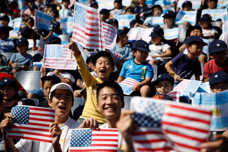 A US supporter waves the US flag before the Japan 2019 Rugby World Cup Pool C match between Argentina and the United States at the Kumagaya Rugby Stadium in Kumagaya. AFP