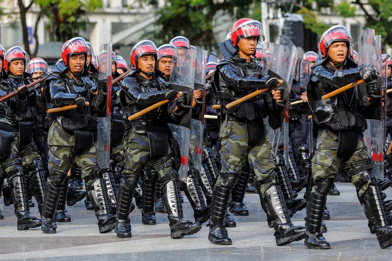 Riot police march in a show of strength. EPA