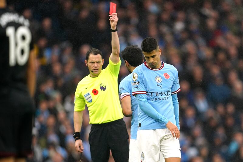 Manchester City's Joao Cancelo  is sent off against Fulham. PA