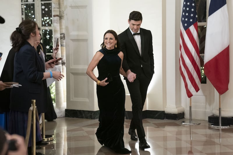 Actress Julia Louis-Dreyfus, left, and son Charles Hall arrive. Bloomberg 