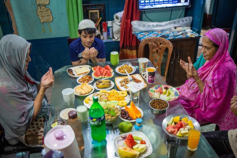 Bangladeshi family members eat iftar in Dhaka, Bangladesh.  EPA