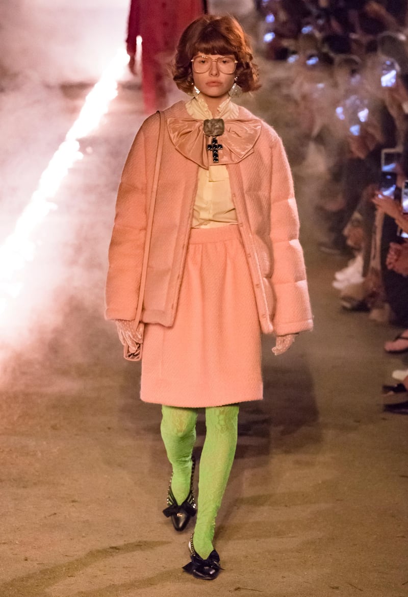 <p>The opening look was a quilted coat and skirt in sugar pink, matched with bright green lace tights.&nbsp;Courtesy of Gucci by Dan Lecca</p>
