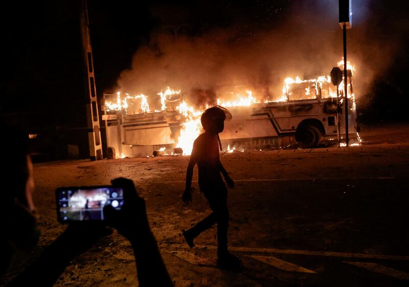 A bus burns close to the residence of Sri Lankan President Gotabaya Rajapaksa in Colombo. Reuters