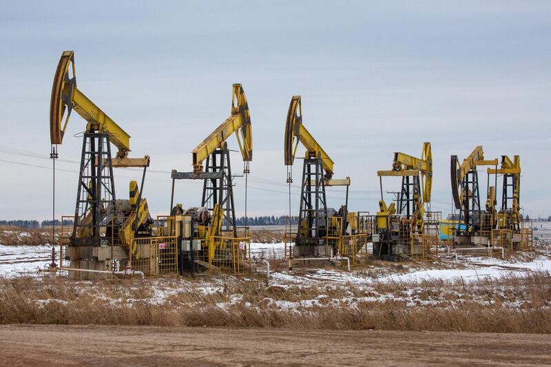 Oil pumping jacks, also known as "nodding donkeys"in a Rosneft Oil Co. oilfield near Sokolovka village, in the Udmurt Republic, Russia, on Friday, Nov. 20, 2020. The flaring coronavirus outbreak will be a key issue for OPEC+ when it meets at the end of the month to decide on whether to delay a planned easing of cuts early next year. Photographer: Andrey Rudakov/Bloomberg