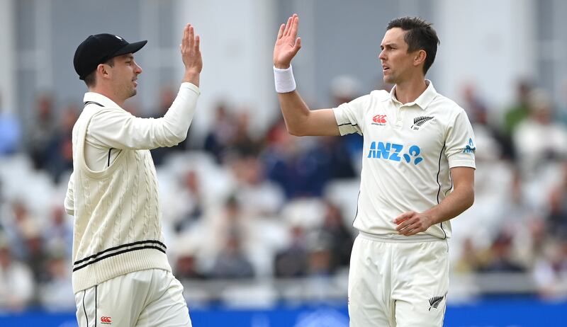 New Zealand bowler Trent Boult is congratulated by Will Young after taking his fifth wicket of Matthew Potts. Getty