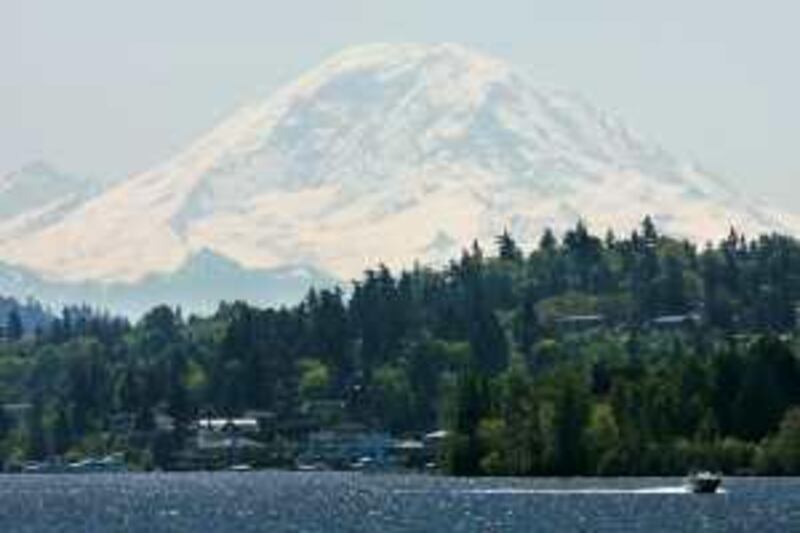 ** FOR IMMEDIATE RELEASE--FILE **Mount Rainier looms in the background as a boat crosses Lake Washington Wednesday, May 3, 2006, near Seattle.  (AP Photo/Ted S. Warren/FILE)