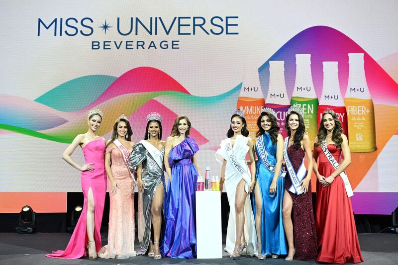 Reigning Miss Universe R'Bonney Gabriel, fourth from right, with other Miss Universe title holders at the launch of Miss Universe Beverage in Bangkok. Photo: Miss Universe Organisation