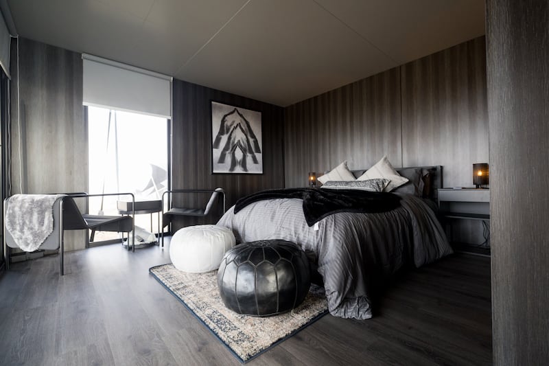 The interiors reflect the outdoors, with black, white and shades of charcoal and rock grey