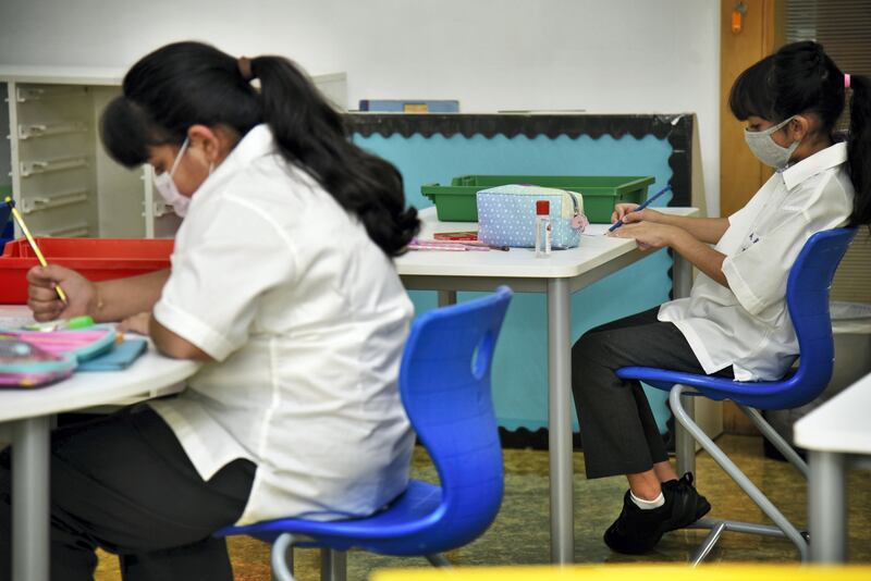 Students wearing protective face masks attend their class at the Al-Mizhar American Academy after the government re-opens schools in the wake of the Covid-19 pandemic, in Dubai, UAE, Sunday, Aug. 30, 2020. (Photos by Shruti Jain - The National)
