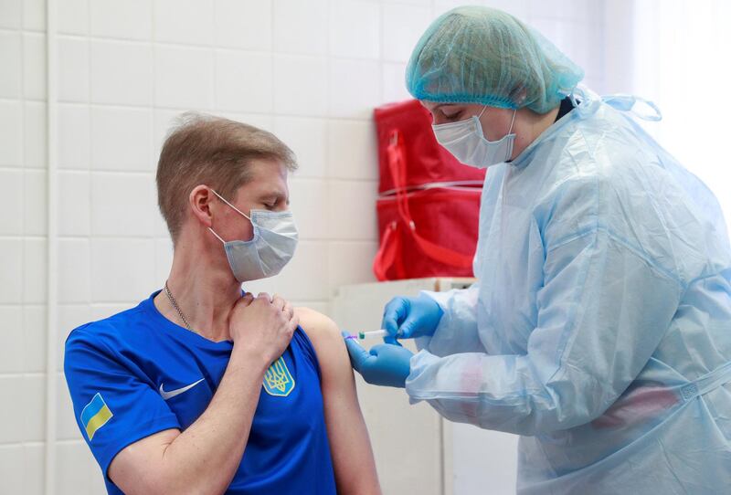 Oleksandr Petriv, a member of the Ukrainian Olympic shooting team that will compete in the Tokyo 2020 Olympics, receives a dose of Chinese-developed CoronaVac vaccine in Kyiv, Ukraine. Reuters