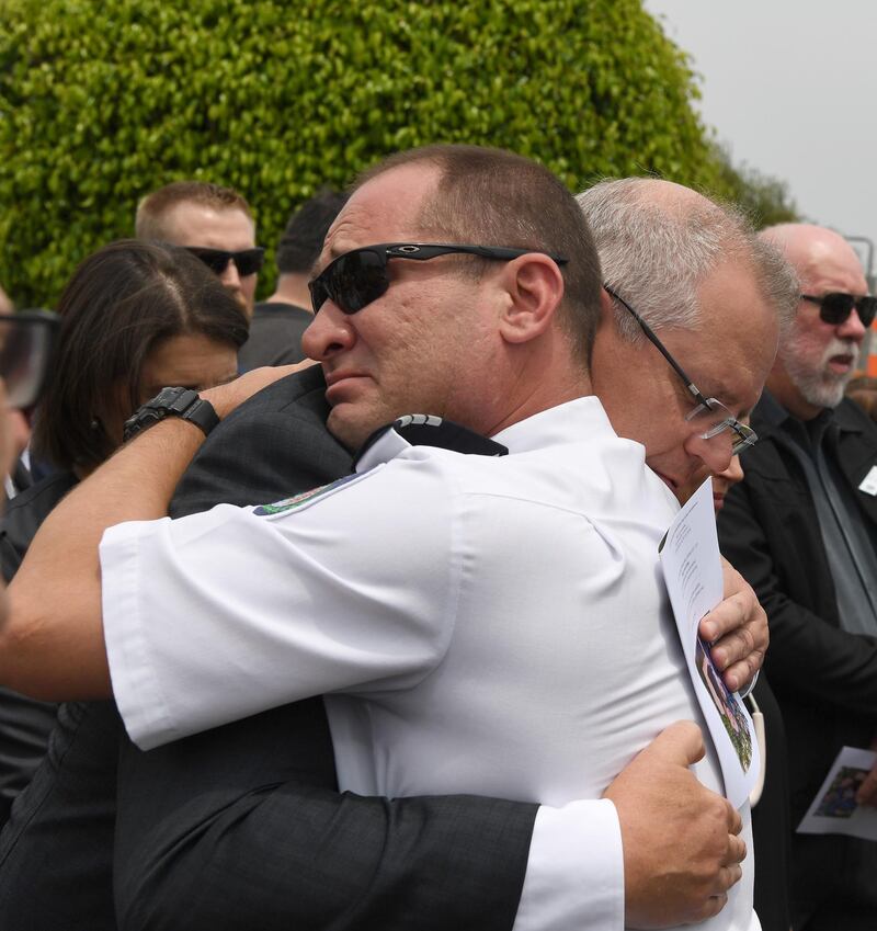 Australian Prime Minister Scott Morrison hugs Horsley Park RFS captain Darren Nation during the funeral for late NSW RFS volunteer Andrew O'Dwyer, at Our Lady of Victories Catholic Church in Horsley Park, Sydney.  EPA