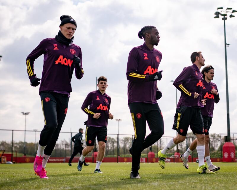 MANCHESTER, ENGLAND - APRIL 14: Scott McTominay, Daniel James, Aaron Wan-Bissaka, Nemanja Matic, Edinson Cavani of Manchester United in action during a first team training session at Aon Training Complex on April 14, 2021 in Manchester, England. (Photo by Ash Donelon/Manchester United via Getty Images)