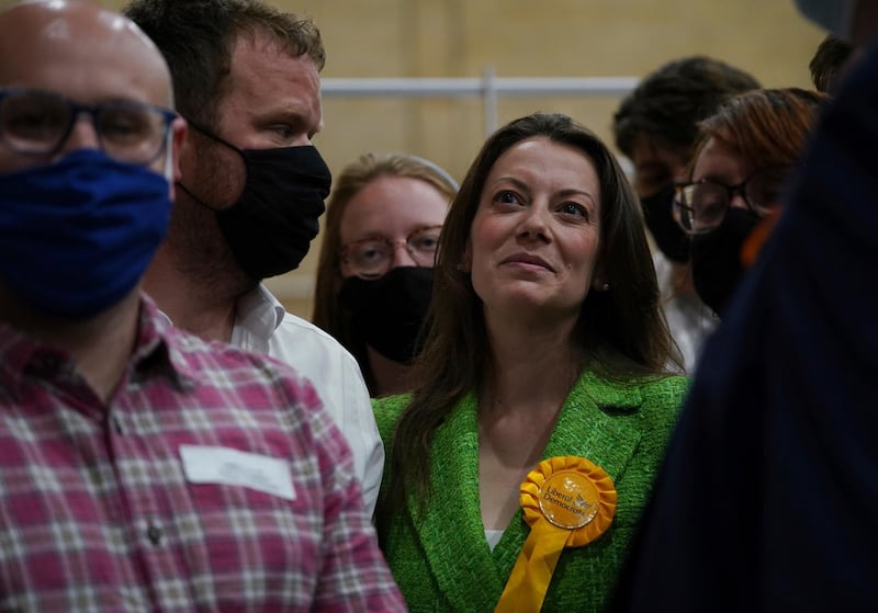 Sarah Green of the Liberal Democrats smiles after after being declared winner in the Chesham and Amersham by-election at Chesham Leisure Centre in Chesham, Buckinghamshire, England where she defeated Conservative candidate Peter Fleet early Friday June 18, 2021. (Yui Mok/PA via AP)