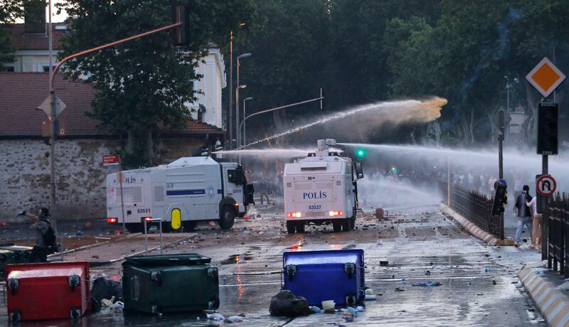 Riot police use water cannons to disperse anti-government protesters in front of Turkish Prime Minister Tayyip Erdogan's Istanbul office June 1, 2013. Erdogan made a defiant call for an end to the fiercest anti-government demonstrations in years on Saturday, as thousands of protesters clashed with riot police in Istanbul and Ankara for a second day. REUTERS/Murad Sezer (TURKEY - Tags: POLITICS CIVIL UNREST)