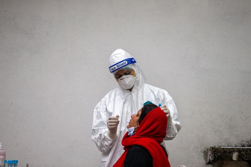 epa09173454 A health worker collects a nose swab sample for a PCR test amid the ongoing coronavirus COVID-19 disease pandemic at a hospital in Kathmandu, Nepal. 02 May 2021. As the number of COVID-19 cases continues to soar, the Ministry of Health and Population has issued a notice saying that it now has become 'next to impossible' for hospitals to provide beds for COVID-19 patients.  EPA/NARENDRA SHRESTHA