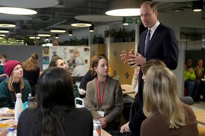 Prince William talks to employees as he visits the British Red Cross at its headquarters. Reuters 
