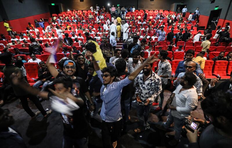 Fans react to his appearance on the screen. EPA