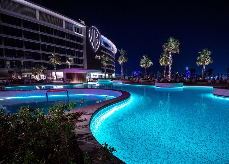 The pool area at night at WB Abu Dhabi