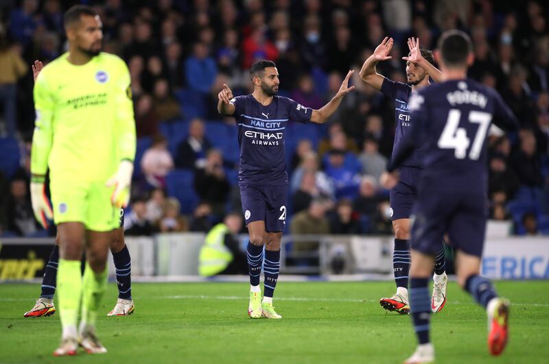 Manchester City's Riyad Mahrez celebrates scoring their fourth goal with Ruben Dias. Reuters