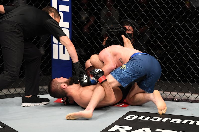 ABU DHABI, UNITED ARAB EMIRATES - OCTOBER 25:  (L-R) Khabib Nurmagomedov of Russia submits Justin Gaethje in their lightweight title bout during the UFC 254 event on October 25, 2020 on UFC Fight Island, Abu Dhabi, United Arab Emirates. (Photo by Josh Hedges/Zuffa LLC via Getty Images)