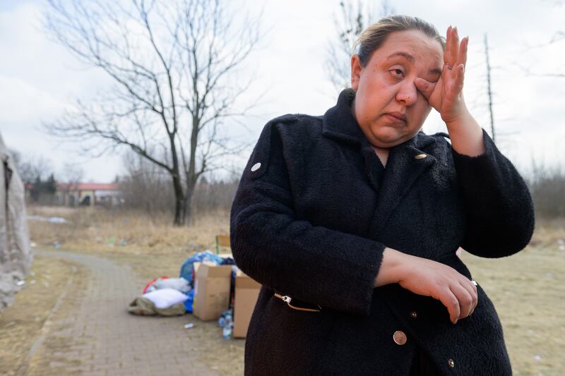 Kristina wipes away tears at Lwowska reception centre on the outskirts of Przemysl, Poland. Photo: DEC