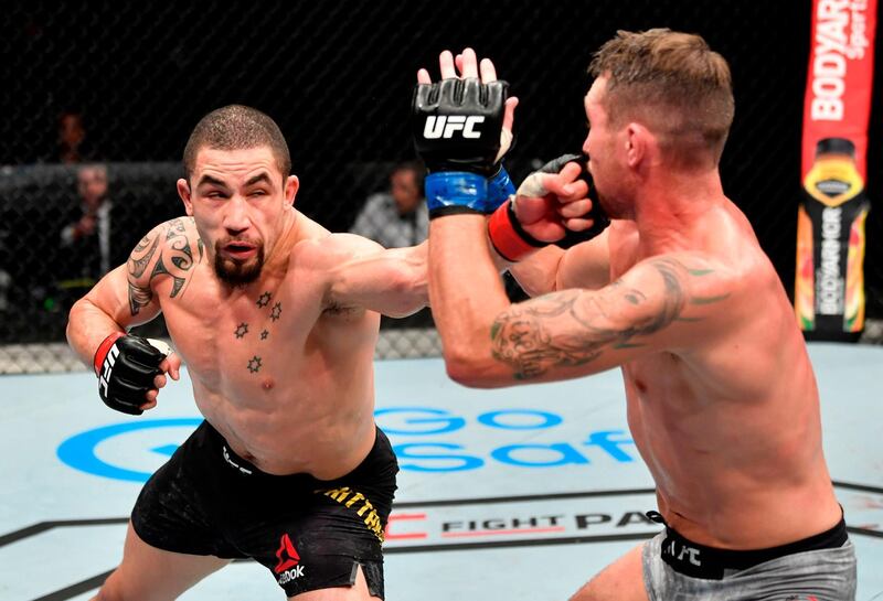 Robert Whittaker of New Zealand lands a punch during his victory over England's Darren Till in their middlewweight bout at UFC's Fight Island in Abu Dhabi on Sunday, July 26. AFP