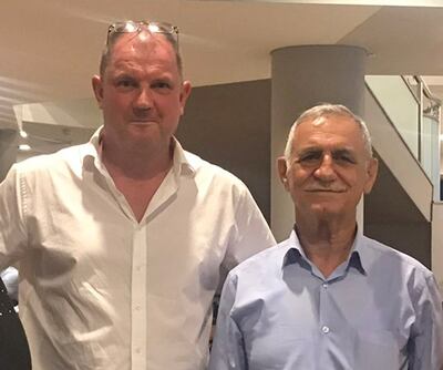 Barry Manners, left, and Shammon Roel, resident engineer of the Dukan Dam in Iraq, where Mr Manners was held hostage in 1990. PA