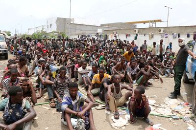 FILE PHOTO: Ethiopian migrants, stranded in war-torn Yemen, sit on the ground of a detention site pending repatriation to their home country, in Aden, Yemen April 24, 2019. REUTERS/Fawaz Salman/File Photo