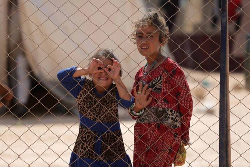 Children who fled Syria's Idlib province are pictured at a camp in Kafr Lusin near the border with Turkey in the northern part of the province. AFP