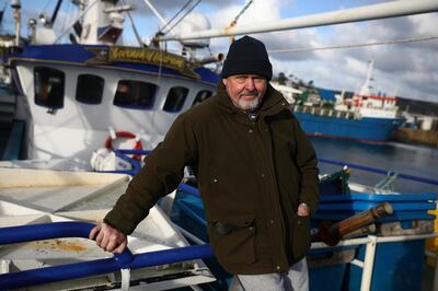 Phil Mitchell, the skipper of Govenek of Ladram fishing boat, poses for a portrait in Penzance Harbour, Britain, December 29, 2020. Picture taken December 29, 2020. REUTERS/Tom Nicholson