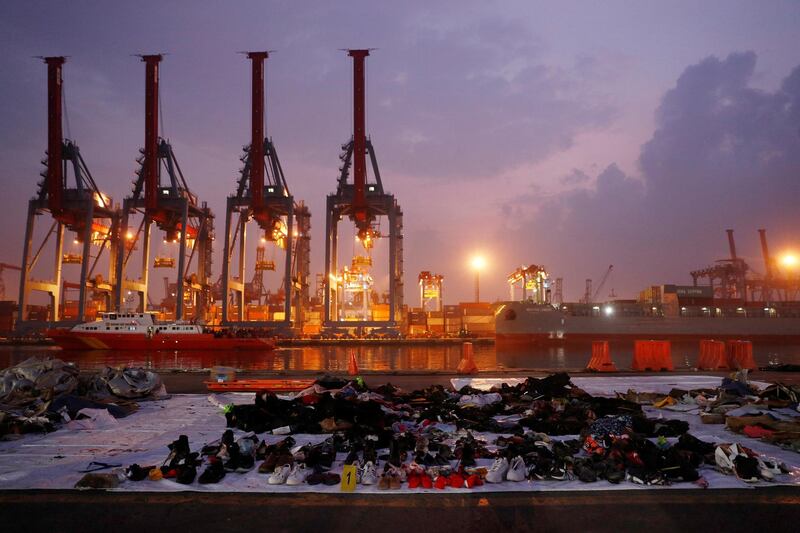 Recovered belongings believed to be from the crashed plane are laid out at Tanjung Priok port. Reuters