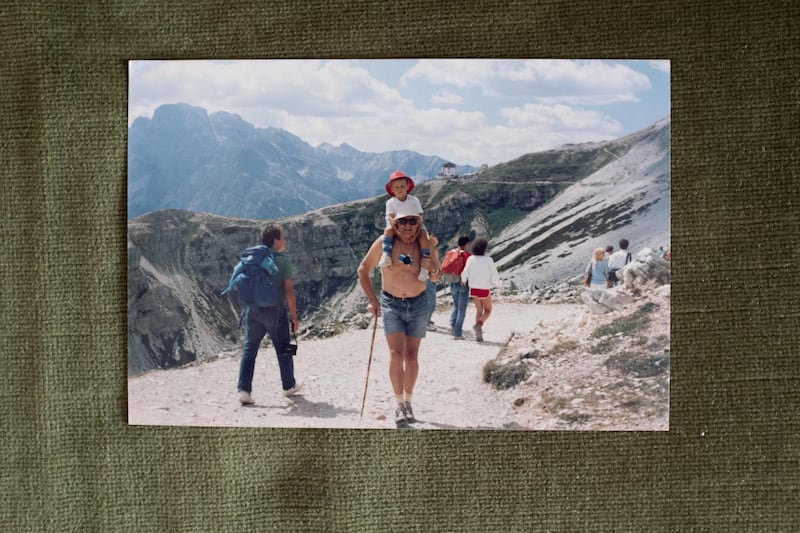 Marzio Toniolo is carried on his grandfather Gino Verani's shoulder's through the mountains in Trentino-Alto Adige, in this undated family photograph taken by Verani's mother, at Verani's home in San Fiorano, Italy, September 5. Marzio Toniolo / Reuters