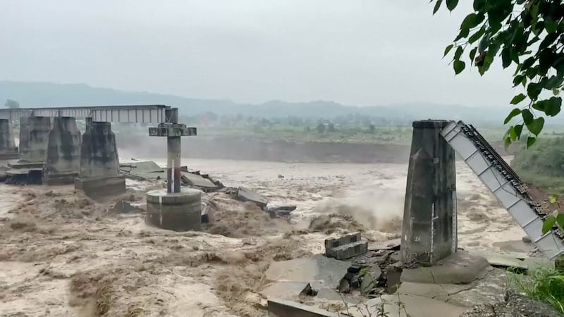 This bridge was washed away by high and fast-flowing waters in Kangra, Himachal Pradesh. Reuters