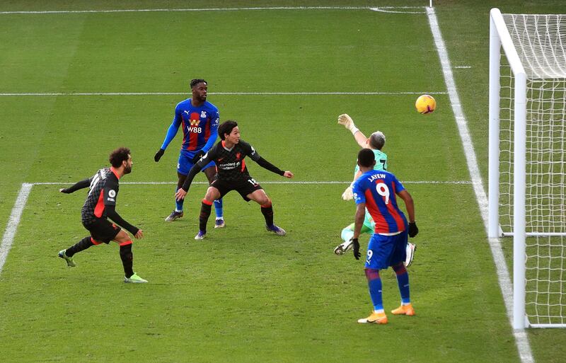 LONDON, ENGLAND - DECEMBER 19:  Mohamed Salah of Liverpool scores their sides seventh goal during the Premier League match between Crystal Palace and Liverpool at Selhurst Park on December 19, 2020 in London, England. The match will be played without fans, behind closed doors as a Covid-19 precaution. (Photo by Adam Davy - Pool/Getty Images)