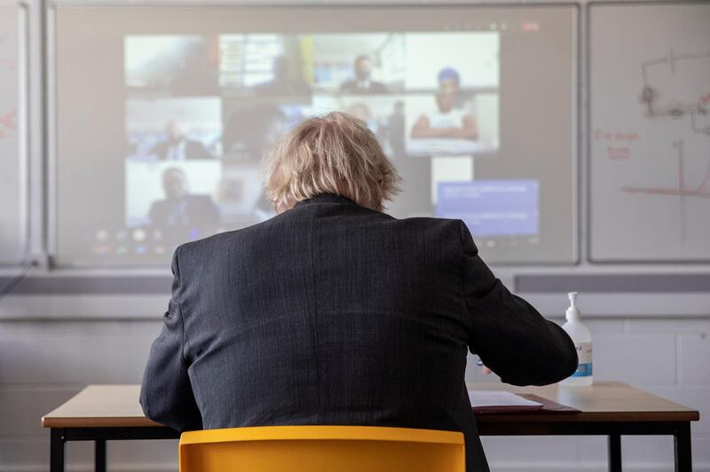 Students join Boris Johnson remotely to take part in the class. Reuters