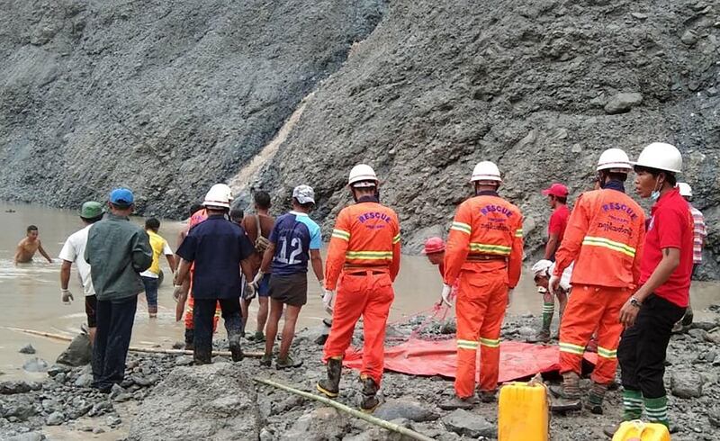 Rescuers attempting to locate survivors after a landslide at a jade mine in Hpakant, Kachin state. AFP