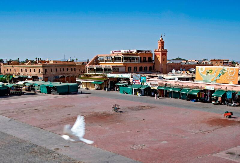 A man walks by mostly-closed stalls at the Jemaa El Fna square in Marrakesh, Morocco. AFP
