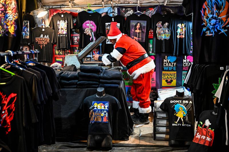 A man dressed as Santa Claus at his shop in Miami, Florida.  AFP