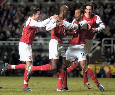 NEWCASTLE, ENGLAND - DECEMBER 29: Thierry Henry of Arsenal congratulates Patrick Vieira on his goal during the FA Barclays Premiership match between Newcastle United and Arsenal at St.James Park on December 29, 2004 in Newcastle, England. (Photo by Matthew Lewis/Getty Images)