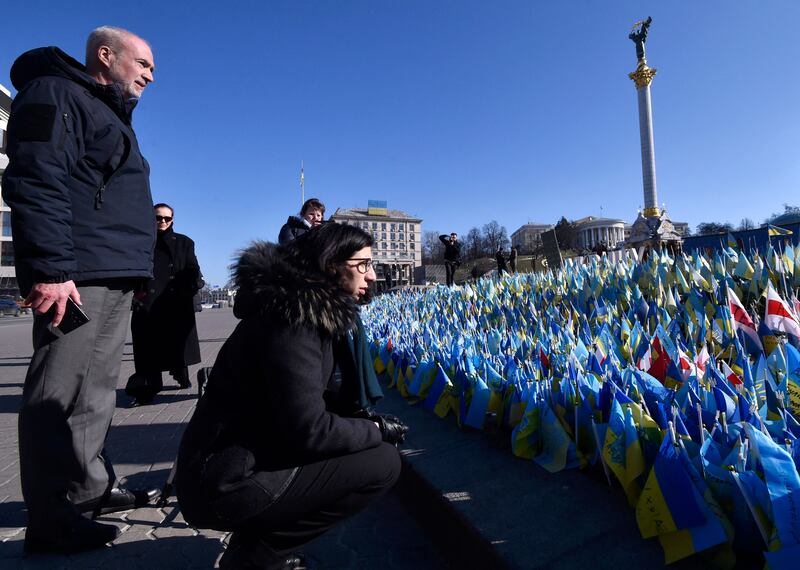 France's ambassador to Ukrain Etienne de Poncins, left, and the French Culture Minister Rima Abdul-Malak visit Independence Square in central Kyiv. AFP