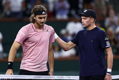 Jenson Brooksby, right, delivered a shock victory over world No 5 Stefanos Tsitsipas. AFP
