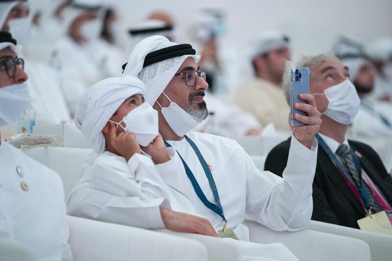 Sheikh Khaled bin Mohamed, chairman of Abu Dhabi Executive Office and member of Abu Dhabi Executive Council, centre, and Sheikh Mohamed bin Khaled, left.