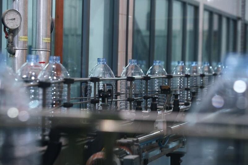Agthia, the Abu Dhabi food and beverage company that produces Al Ain water, reported a 2 per cent rise in its third-quarter revenue. Delores Johnson / The National